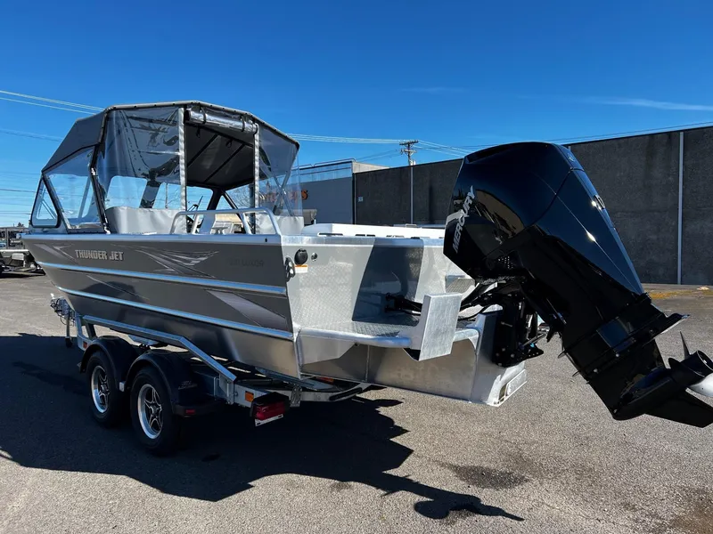 Slide: The Image of 2024 Thunder Jet 210 Luxor boat with outboard motor on trailer. - 3