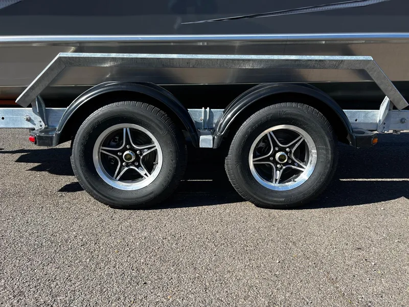 Slide: The Image of 2024 Thunder Jet 210 Luxor boat trailer with dual axle wheels. - 7