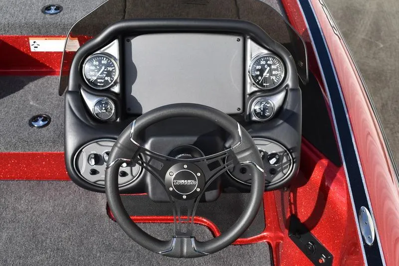 Slide: The Image of 2024 Triton 179 TrX boat dashboard with steering wheel and gauges. - 22