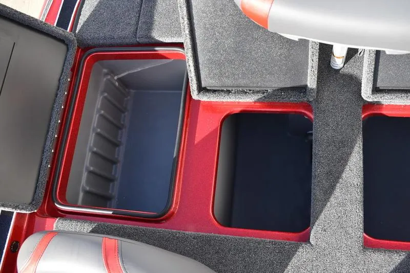 Slide: The Image of 2024 Triton 179 TrX boat storage compartments with open lids, showcasing interior space. - 25