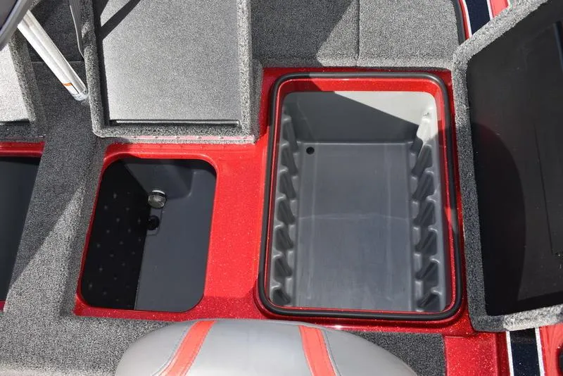 Slide: The Image of 2024 Triton 179 TrX boat storage compartments with red and gray interior detailing. - 26