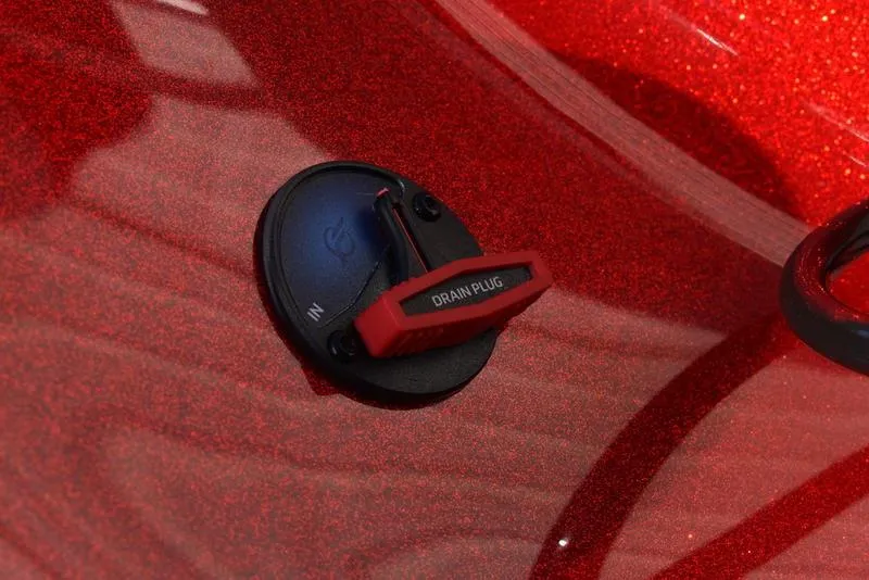 Slide: The Image of 2024 Triton 179 TrX red drain plug detail on boat surface. - 28