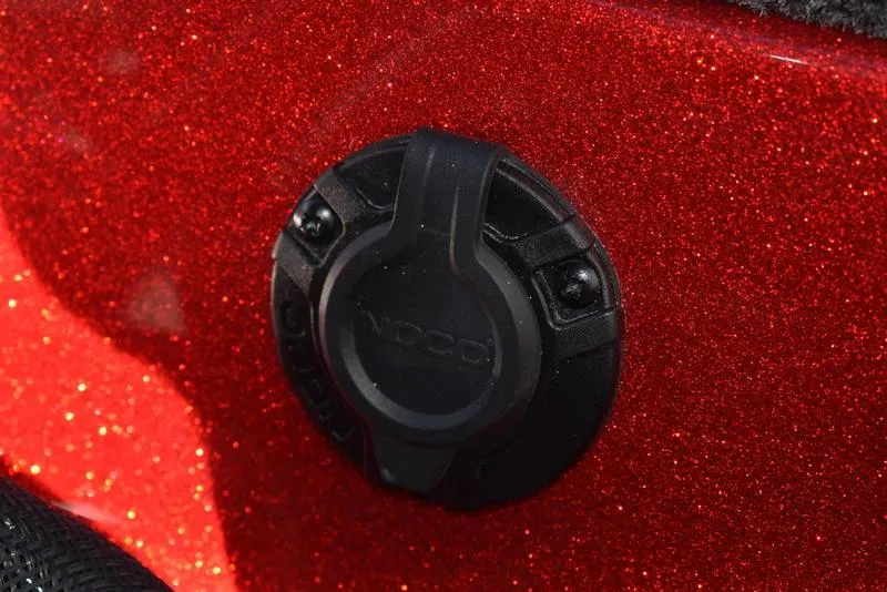 Slide: The Image of Close-up of a NOCO charging port on a 2024 Triton 179 TrX boat, red metallic finish. - 30