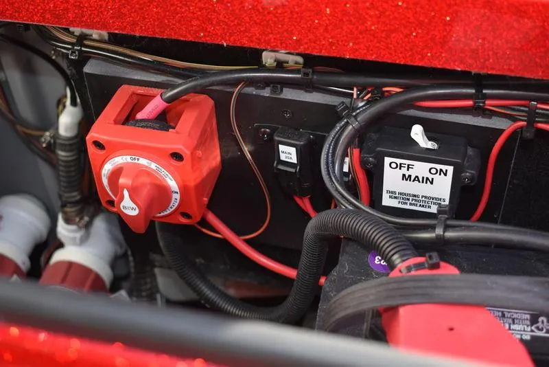 Slide: The Image of 2024 Triton 179 TrX boat electrical system with red switch and wiring components. - 31