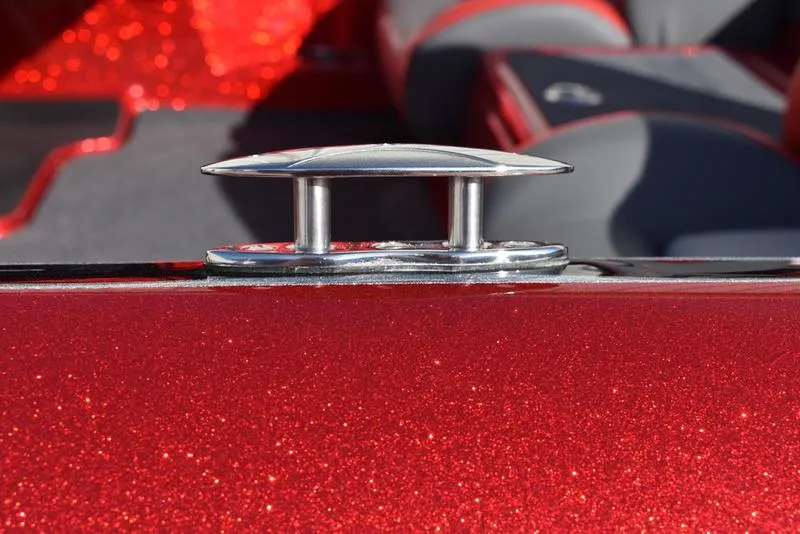 Slide: The Image of 2024 Triton 179 TrX boat with metallic red finish and chrome cleat detail. - 33