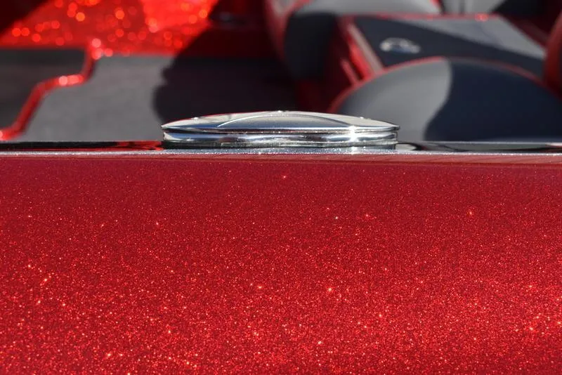 Slide: The Image of 2024 Triton 179 TrX boat with sparkling red finish and sleek chrome detail. - 34