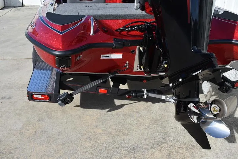 Slide: The Image of 2024 Triton 179 TrX boat rear view with motor and propeller on trailer. - 8