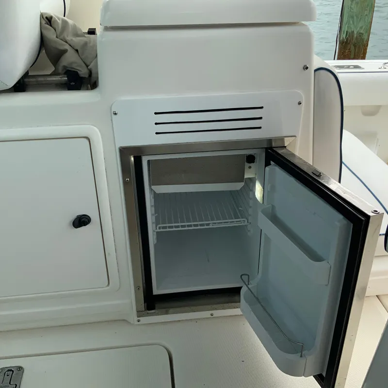 Slide: The Image of Open mini fridge on a 2000 Tiara Sport 35 Open boat. - 10