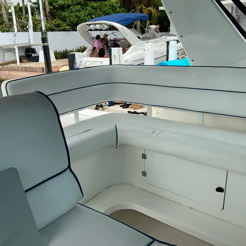 Slide: The Image of Interior seating of a 2000 Tiara Sport 35 Open boat docked at a marina. - 12