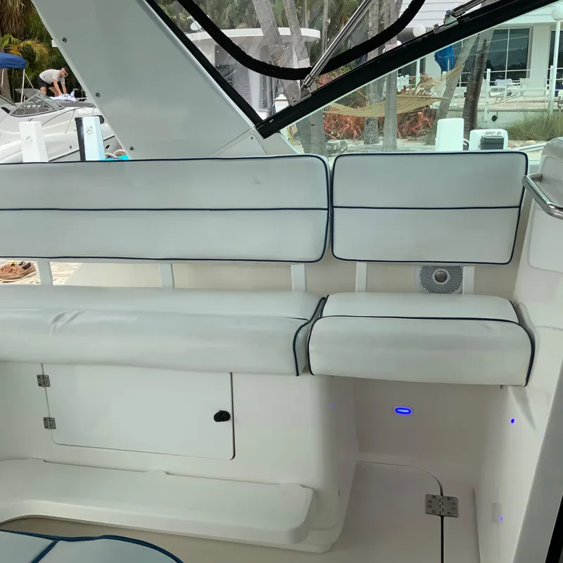 Slide: The Image of Interior seating of a 2000 Tiara Sport 35 Open boat with white cushions. - 13