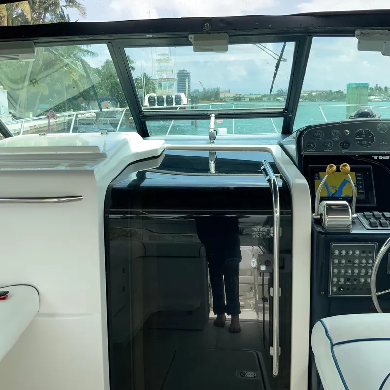 Slide: The Image of Helm station of a 2000 Tiara Sport 35 Open boat with ocean view. - 14