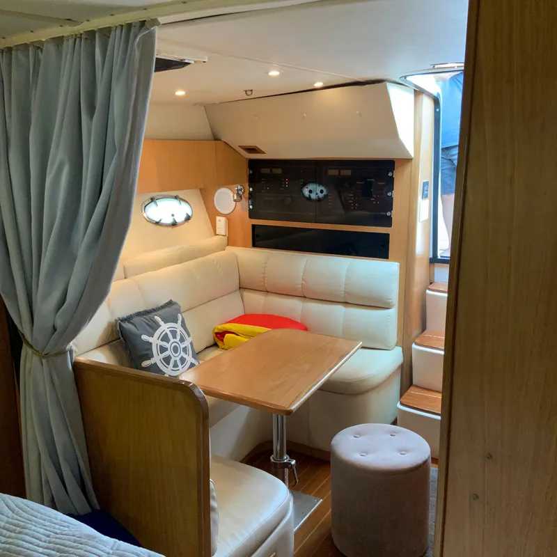 Slide: The Image of Interior of a 2000 Tiara Sport 35 Open yacht with cozy seating and dining area. - 17