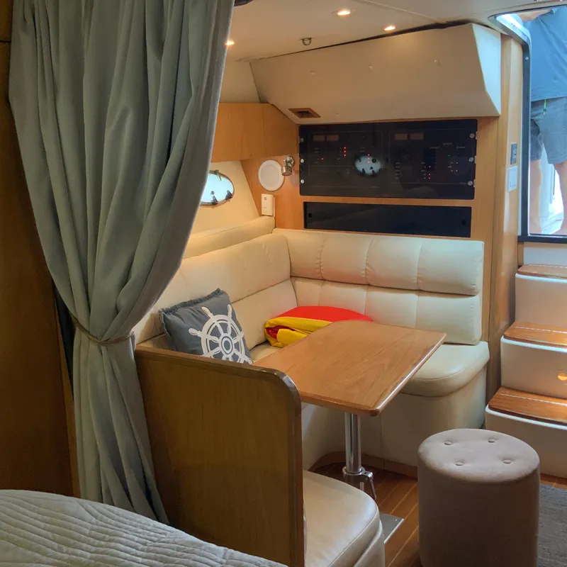 Slide: The Image of Interior of a 2000 Tiara Sport 35 Open yacht with a cozy seating area. - 19