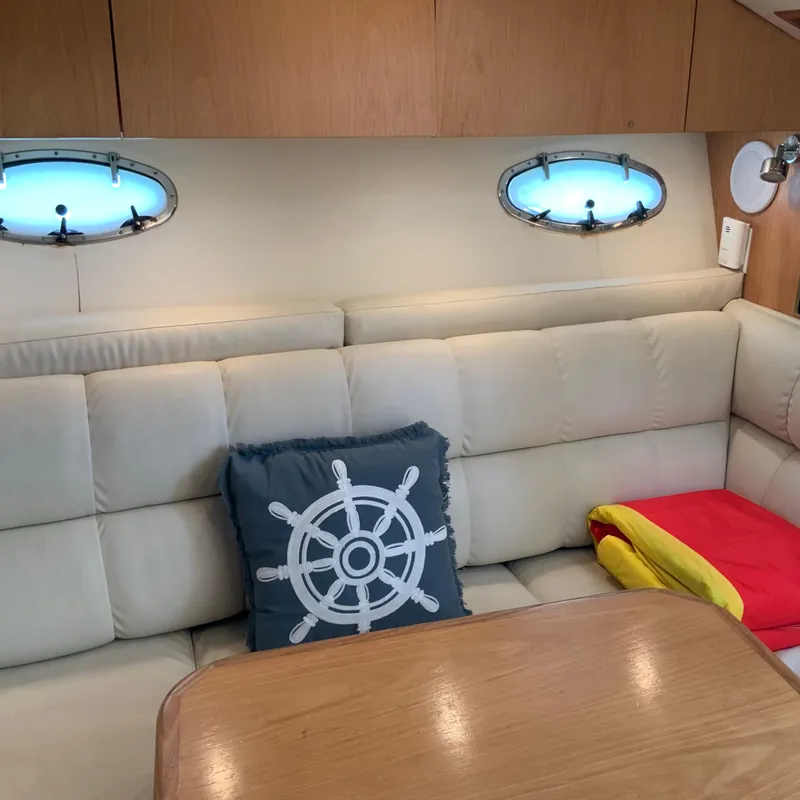 Slide: The Image of Interior of a 2000 Tiara Sport 35 Open yacht with cushioned seating and nautical decor. - 28