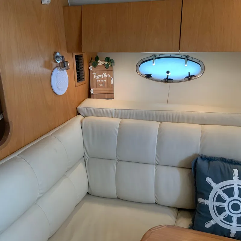 Slide: The Image of Interior of a 2000 Tiara Sport 35 Open boat with white leather seating. - 29