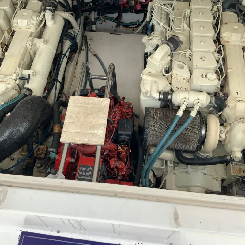 Slide: The Image of Engine compartment of a 2000 Tiara Sport 35 Open boat showing twin engines. - 32