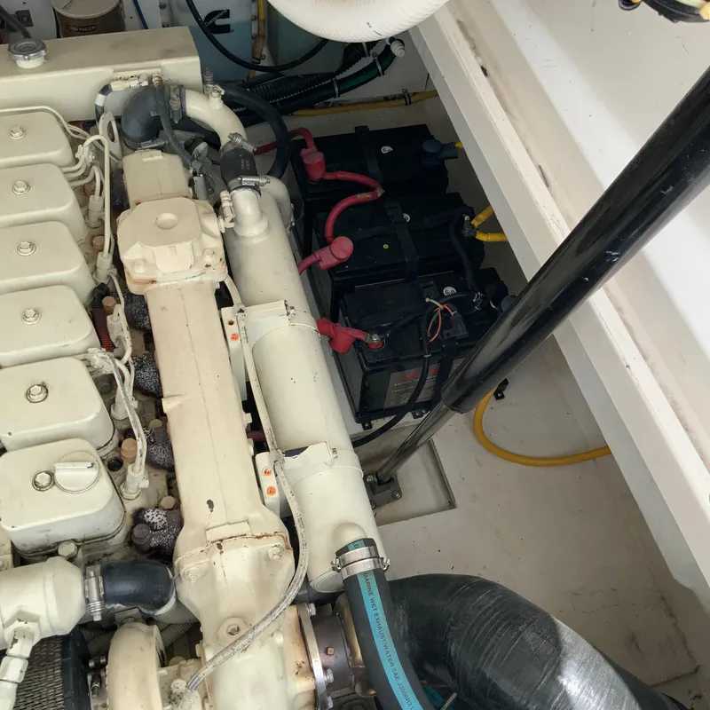 Slide: The Image of Engine compartment of a 2000 Tiara Sport 35 Open boat with batteries. - 38