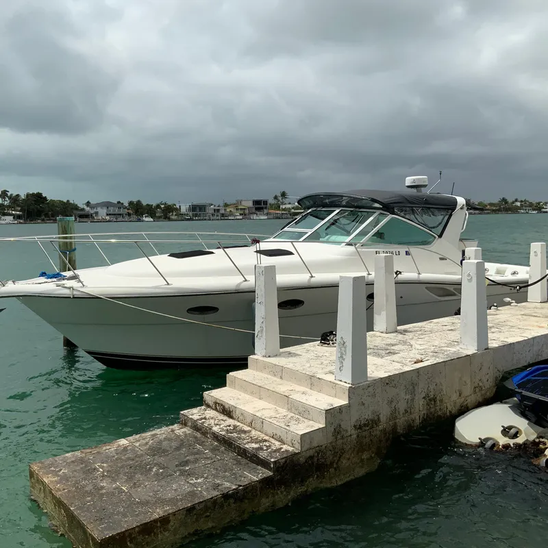 Slide: The Image of Tiara Sport 35 Open 2000 model yacht docked at a marina. - 4