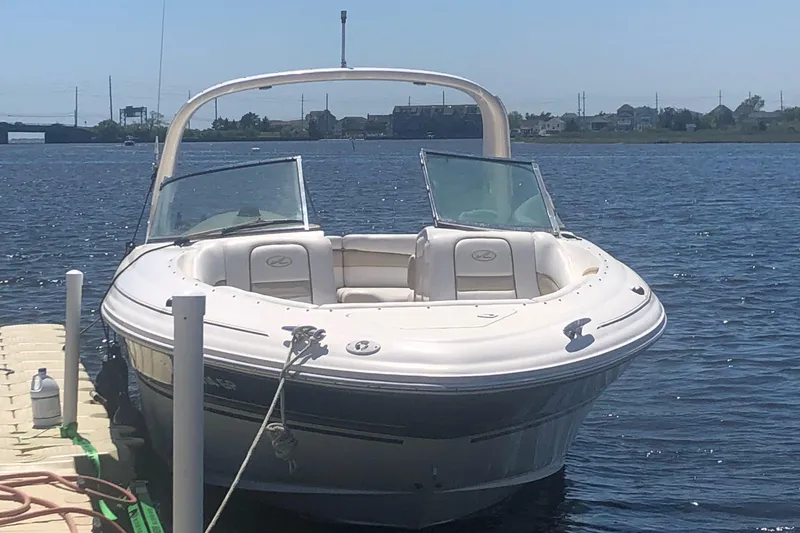 Slide: The Image of 2001 Sea Ray 290 Bowrider docked on a sunny day. - 13