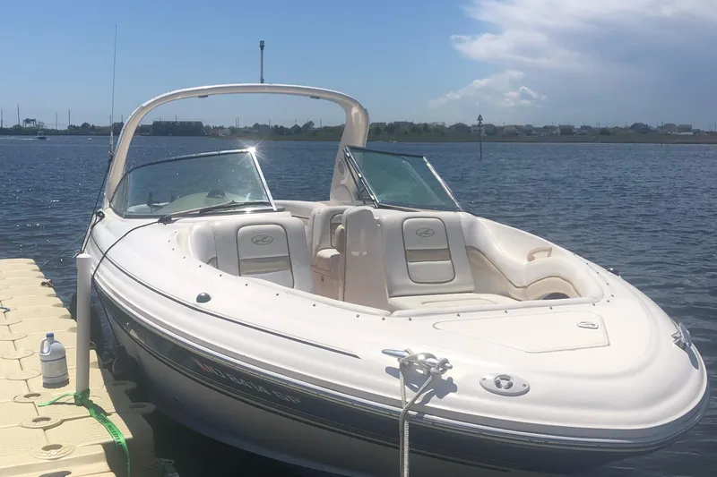 Slide: The Image of 2001 Sea Ray 290 Bowrider docked on a sunny day. - 15