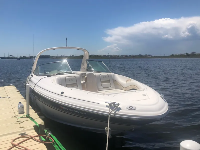 Slide: The Image of 2001 Sea Ray 290 Bowrider docked on a sunny day. - 7