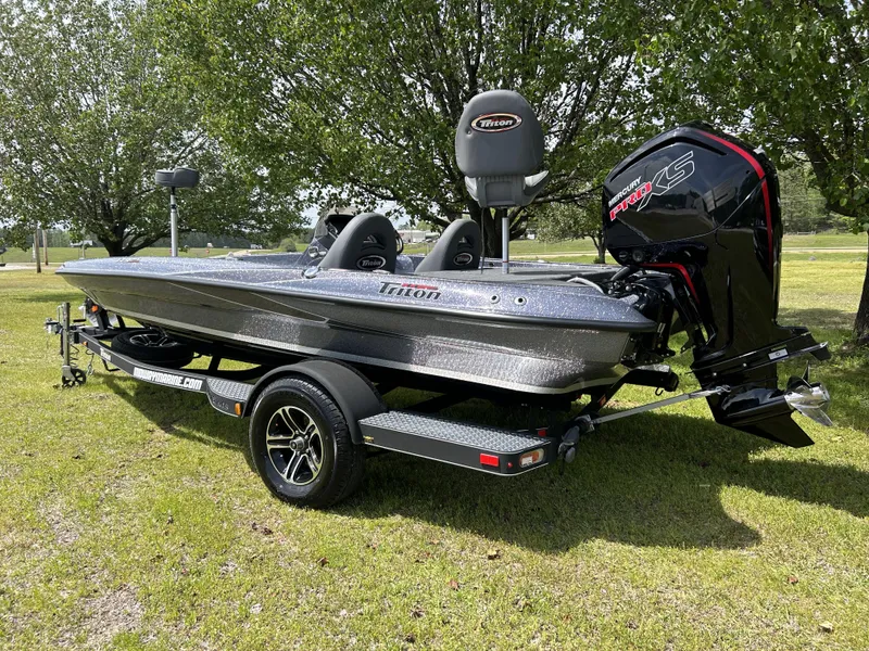 Slide: The Image of 2024 Triton 179 TrX bass boat with Mercury Pro XS engine on a trailer. - 3