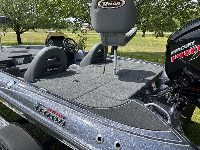 Slide: The Image of 2024 Triton 179 TrX fishing boat with Mercury Pro XS engine, gray interior, and spacious deck. - 4