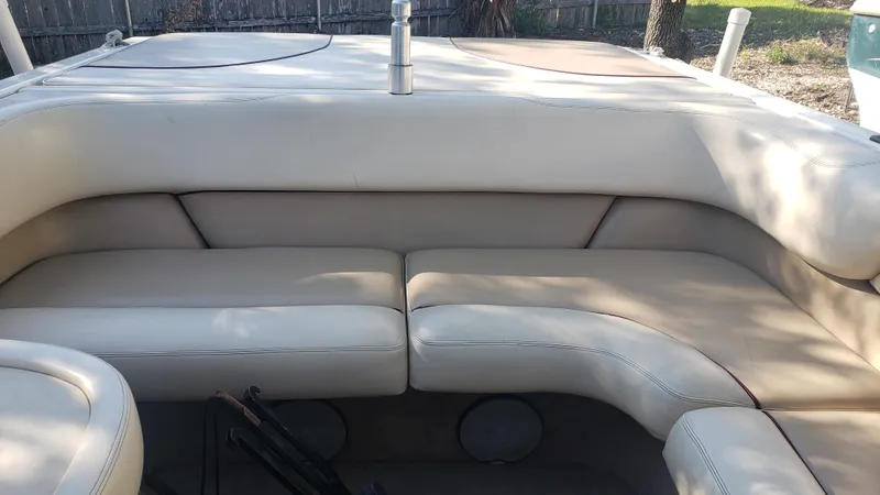 Slide: The Image of 1998 Malibu Sunsetter VLX boat interior with white leather seating. - 14