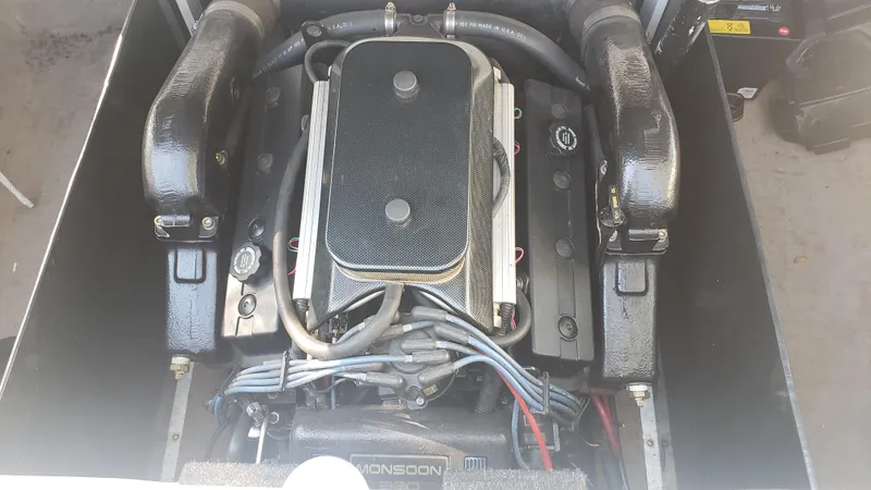 Slide: The Image of 1998 Malibu Sunsetter VLX engine compartment with Monsoon engine. - 21