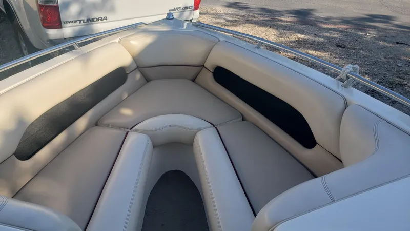 Slide: The Image of 1998 Malibu Sunsetter VLX boat with beige interior seating. - 7
