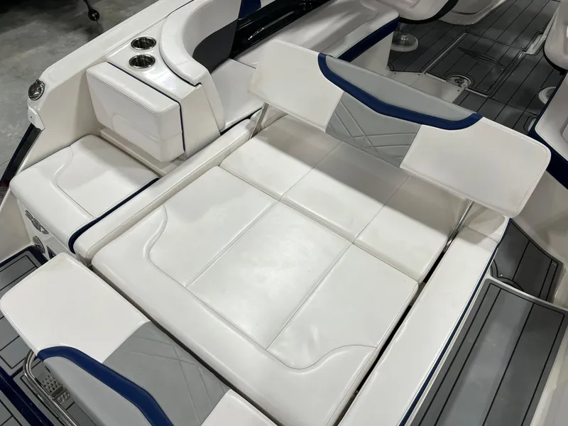 Slide: The Image of 2021 Chaparral 287 SSX boat interior with white and blue seating. - 15