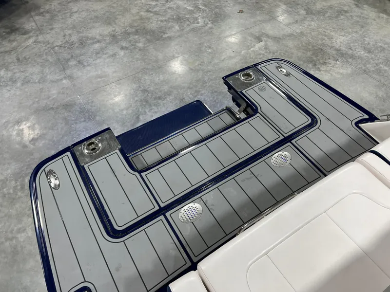 Slide: The Image of 2021 Chaparral 287 SSX swim platform with sleek gray and blue design. - 6