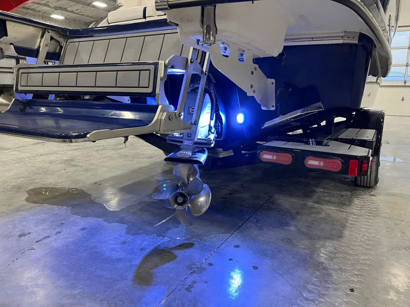 Slide: The Image of 2021 Chaparral 287 SSX boat stern with propeller and blue LED lighting. - 7