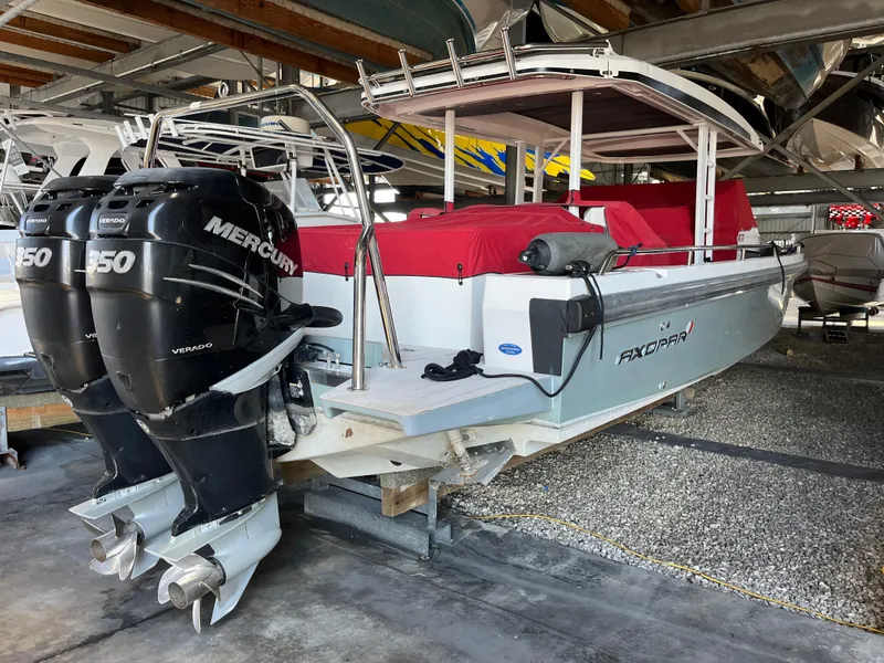 Slide: The Image of 2019 Axopar 37 Sun Top with twin Mercury 150 engines in storage. - 14