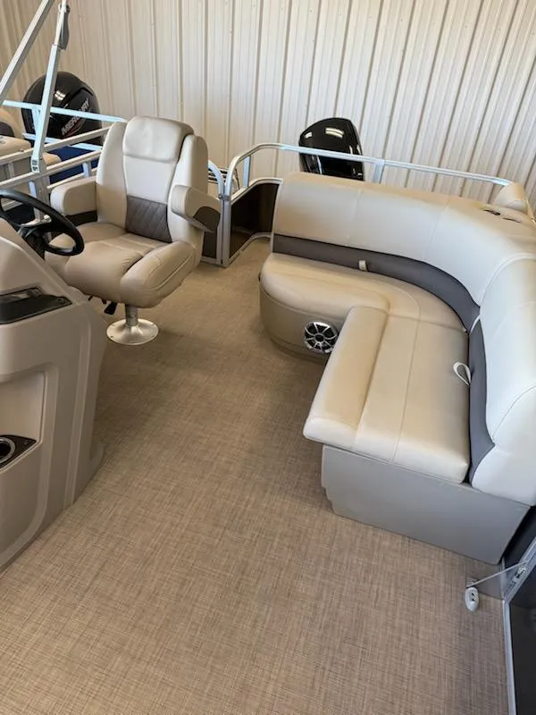 Slide: The Image of 2024 Sun Tracker Party Barge 18 DLX interior with plush seating and modern design. - 2