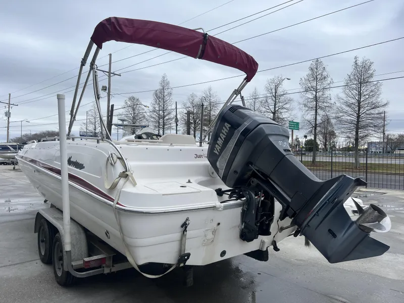 Slide: The Image of 2005 Hurricane 237 boat with Yamaha outboard motor on trailer. - 2