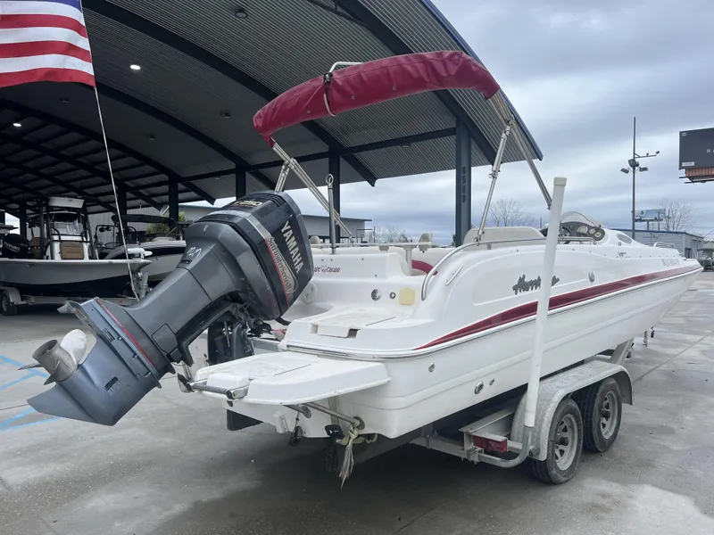 Slide: The Image of 2005 Hurricane 237 boat with Yamaha outboard motor on trailer. - 4