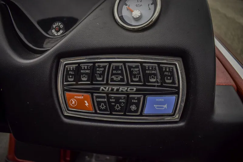 Slide: The Image of Control panel of a 2017 Nitro Z21 boat with various switches and gauges. - 10