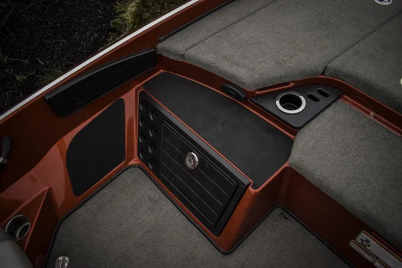 Slide: The Image of 2017 Nitro Z21 boat interior with storage compartments and cup holder. - 14