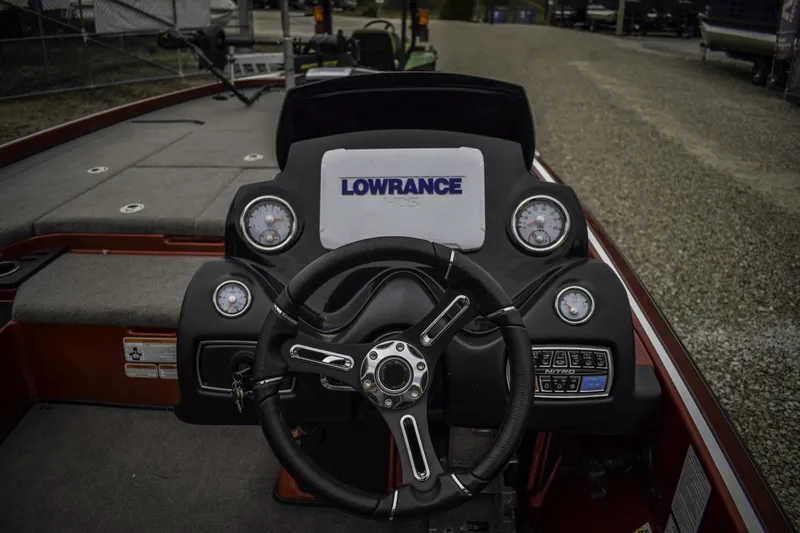 Slide: The Image of 2017 Nitro Z21 boat dashboard with Lowrance electronics and steering wheel. - 9