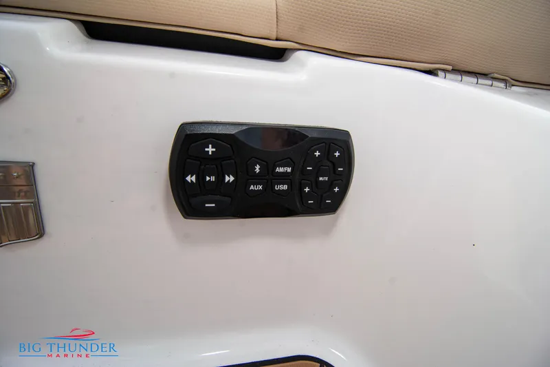 Slide: The Image of Control panel on a 2024 MasterCraft XT24 boat, featuring audio and navigation buttons. - 12