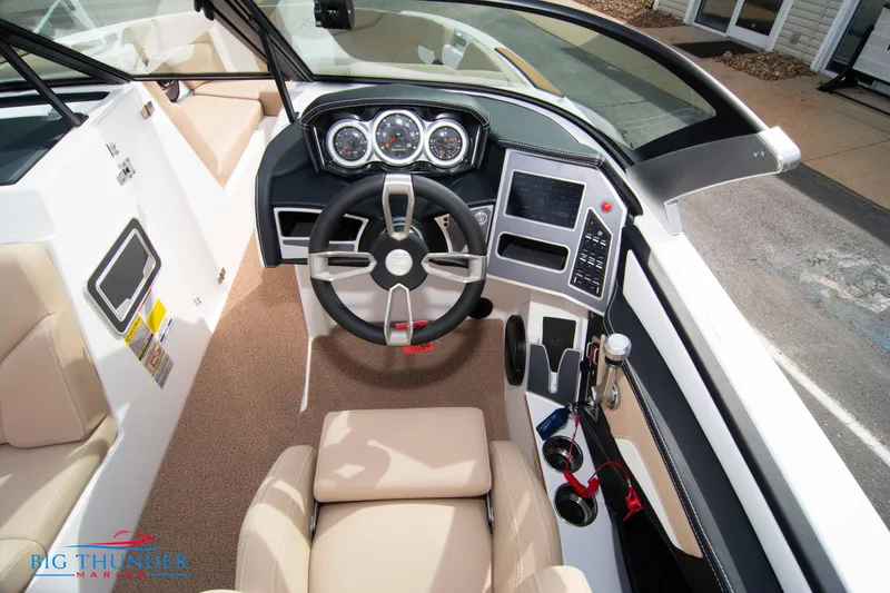 Slide: The Image of 2024 MasterCraft XT24 boat cockpit with modern steering wheel and dashboard. - 28