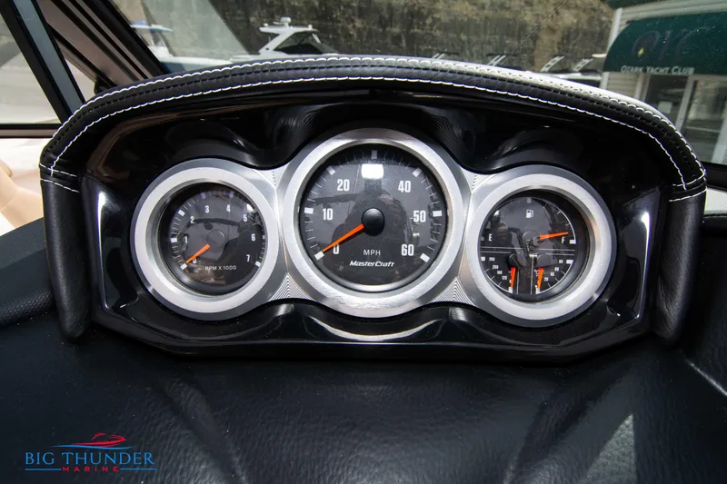 Slide: The Image of 2024 MasterCraft XT24 boat dashboard with speedometer and gauges. - 31
