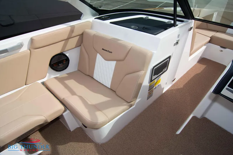 Slide: The Image of 2024 MasterCraft XT24 boat interior with beige seating and modern design. - 39