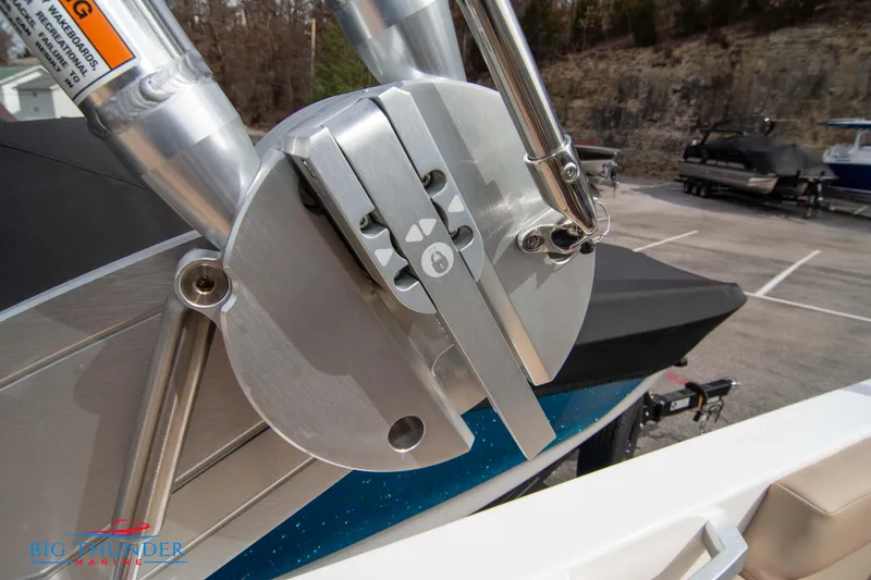 Slide: The Image of Close-up of 2024 MasterCraft XT24 boat's metal component in a marina. - 47