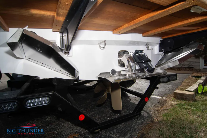 Slide: The Image of 2024 MasterCraft XT24 boat propeller and rudder system on a trailer. - 7