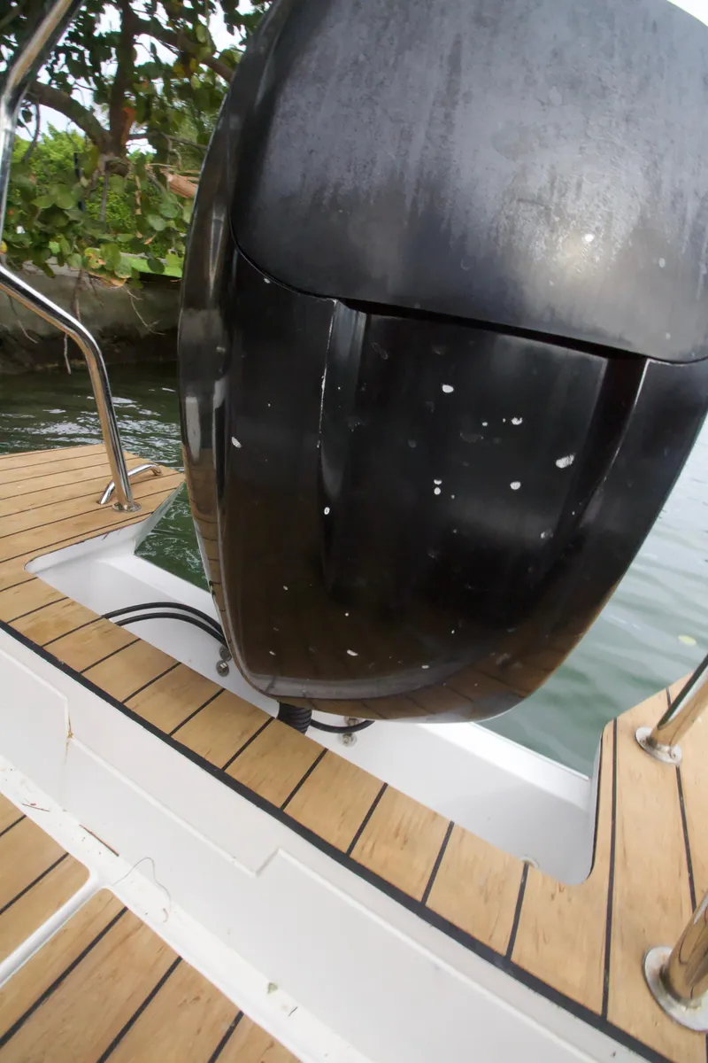 Slide: The Image of Close-up of the outboard motor on a 2016 Axopar 28 TT boat. - 17