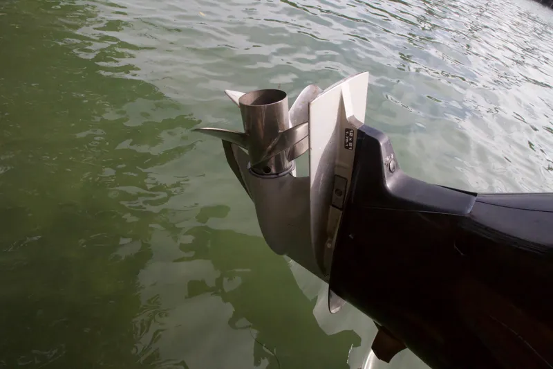 Slide: The Image of Outboard motor of a 2016 Axopar 28 TT boat in water. - 18