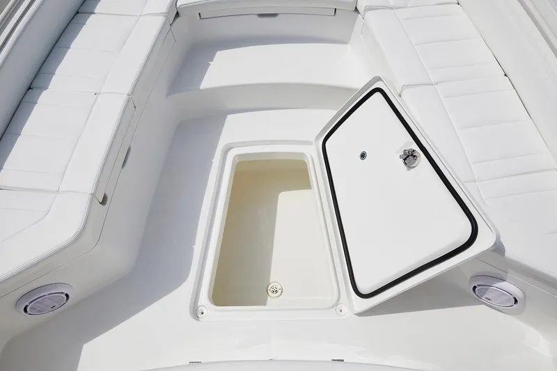 Slide: The Image of 2024 Regulator 26XO boat interior with spacious seating and storage compartments. - 10
