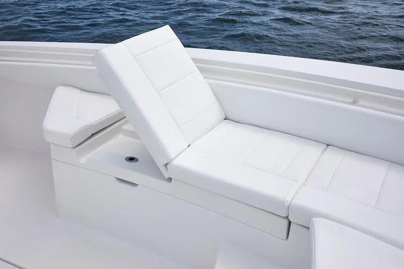 Slide: The Image of 2024 Regulator 26XO boat, white deck, docked at marina, aerial view. - 11